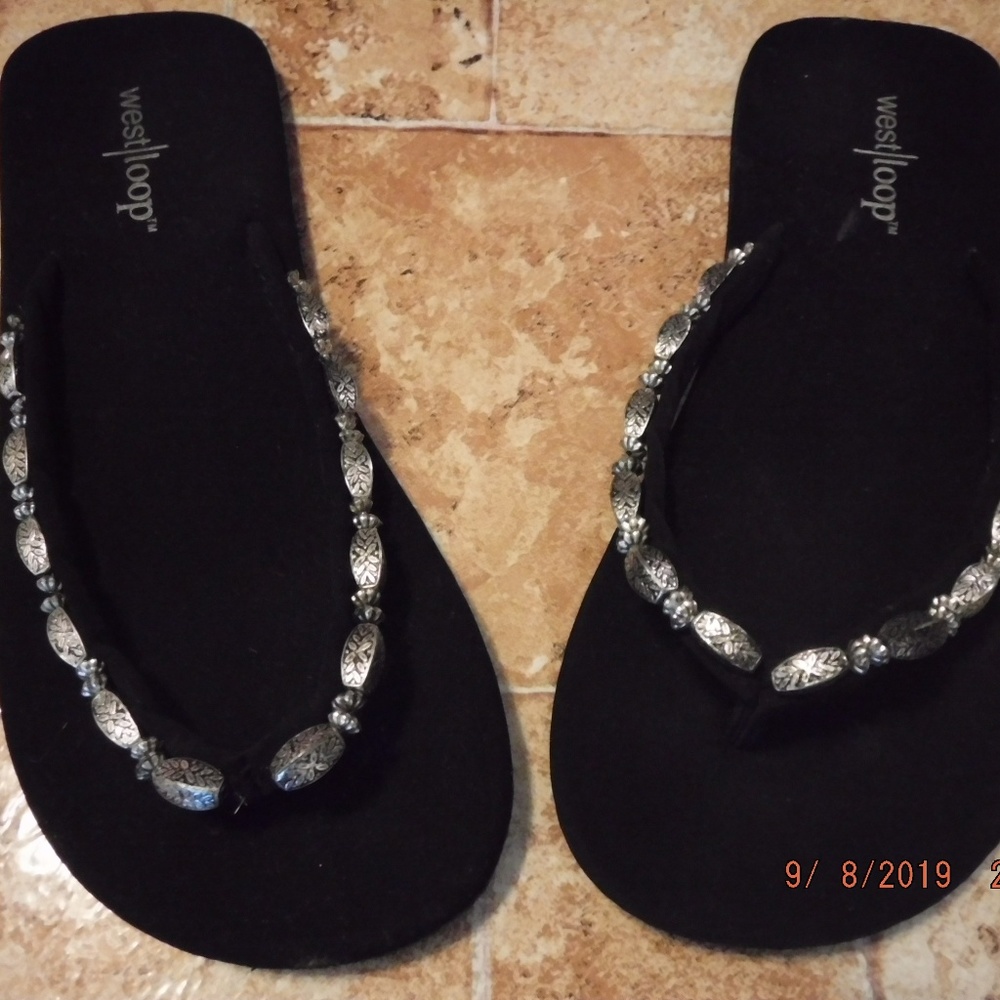 Flat, between toe sandals.